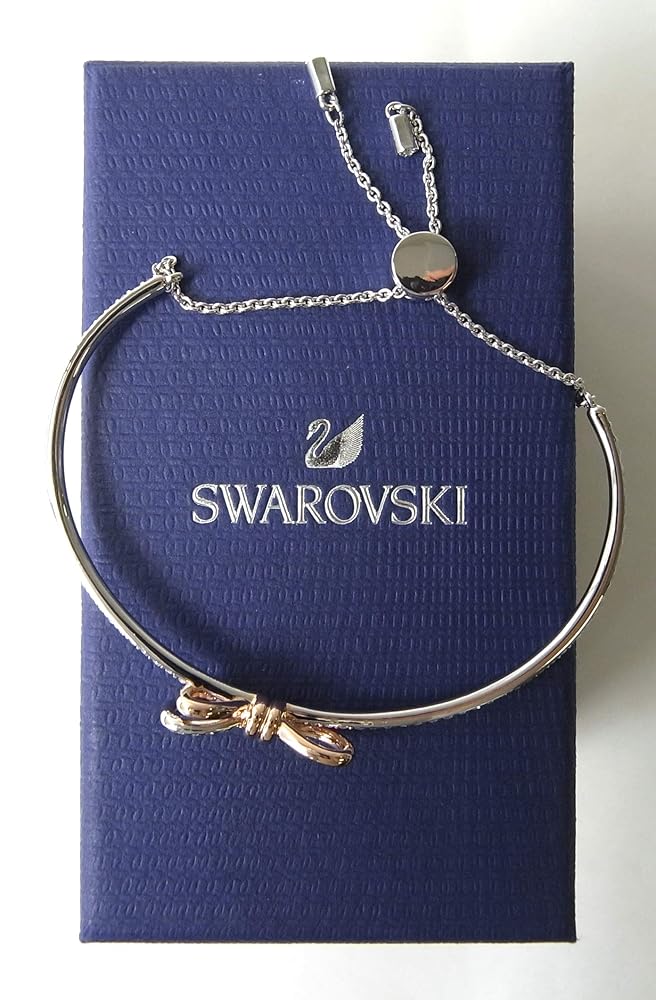 そのSWAROVSKI スワロフスキーブレスレットバングルライフロングボウ Lifelong Bow bangle, Bow, White, Mixed metal finish | Swarovski